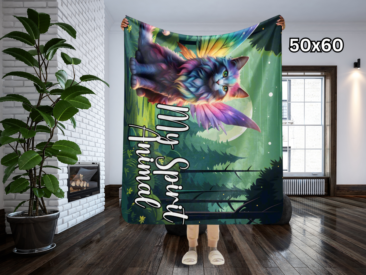 Lightweight Sherpa Throw Blanket 50"x60" held up by model. Models hands are above her head and the blanket reaches right below her knees. Longhaired Maine Coon Cat in Rainbow Fur with Fairy Wings in Rainbow colors. Fairy Cat is sitting in a moonlit forest with a full moon behind the cat. The background is in greens. The cat is pinks, purple, blue, yellow, and orange pastels. Text to the right of the cat in white, My Spirit Animal. Fantasy Couch throw blanket