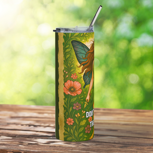 Stainless Steel Tumbler 20 oz. Left side view of the blue/green butterfly wing, left arm holding a pointed knife, and flowers. At the top you can see the metal straw sticking up out of the plastic BPA free lid. 