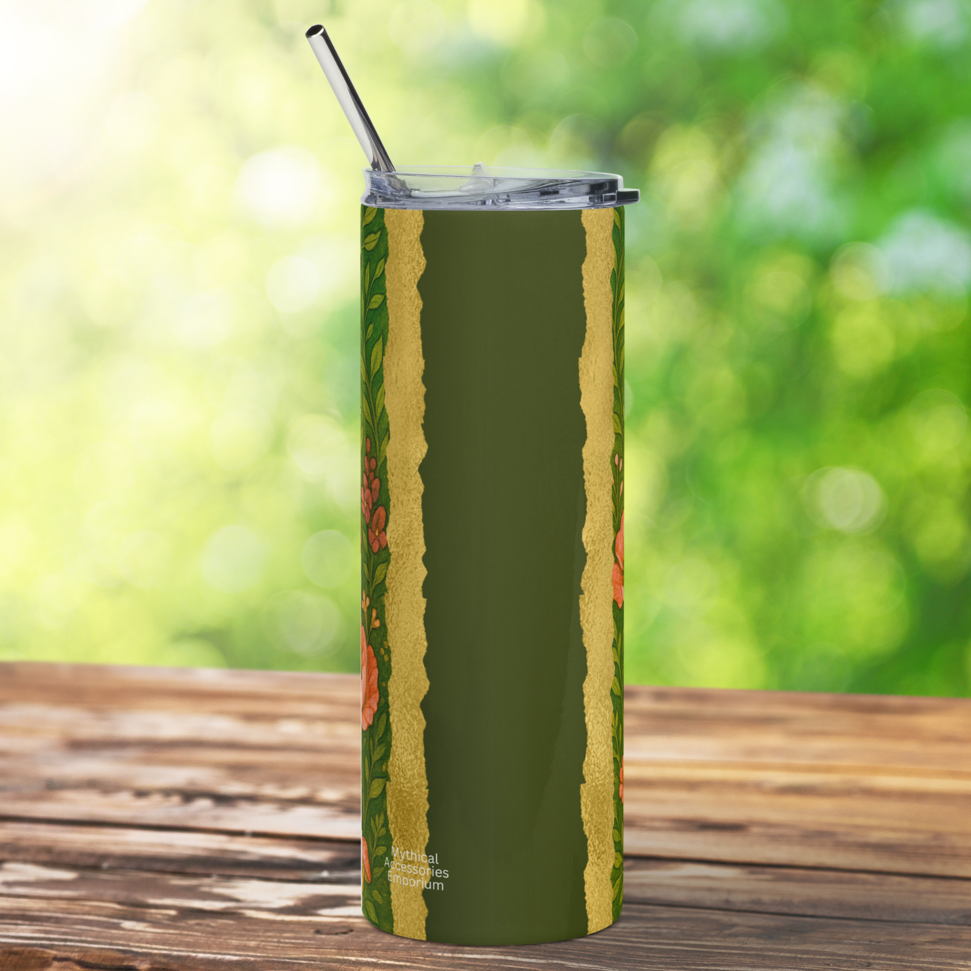 Back side view of Fairy 20 oz Stainless Steel Tumbler. Metal straw is sticking up above the BPA free plastic lid. On the back you see dark olive green with a gold banding to the left and right. On each side you glimpse flowers and leaves. 