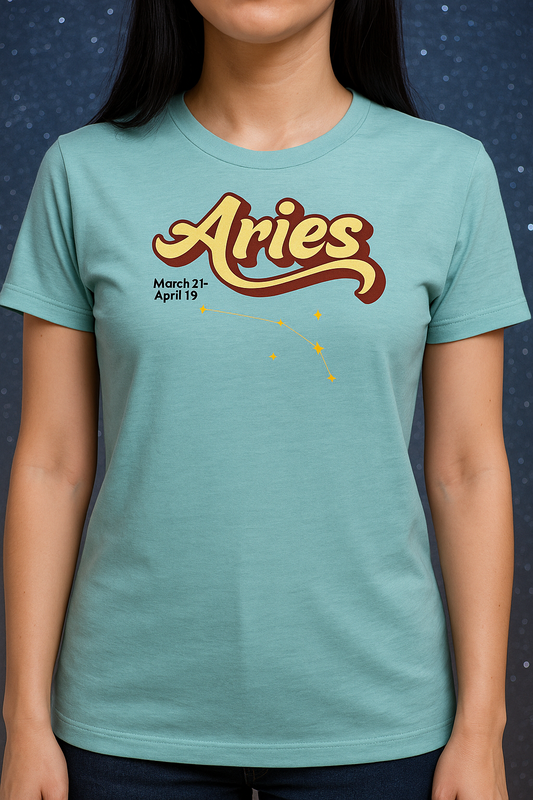 Woman wearing a heather blue lagoon t-shirt facing forward. On the top is the word Aries in light yellow lined with maroon. Under the A are the dates March 21-April 19. Below his is the constellation Aries in bright yellow orange stars connected with a black line. Aries constellation zodiac astrology sign.