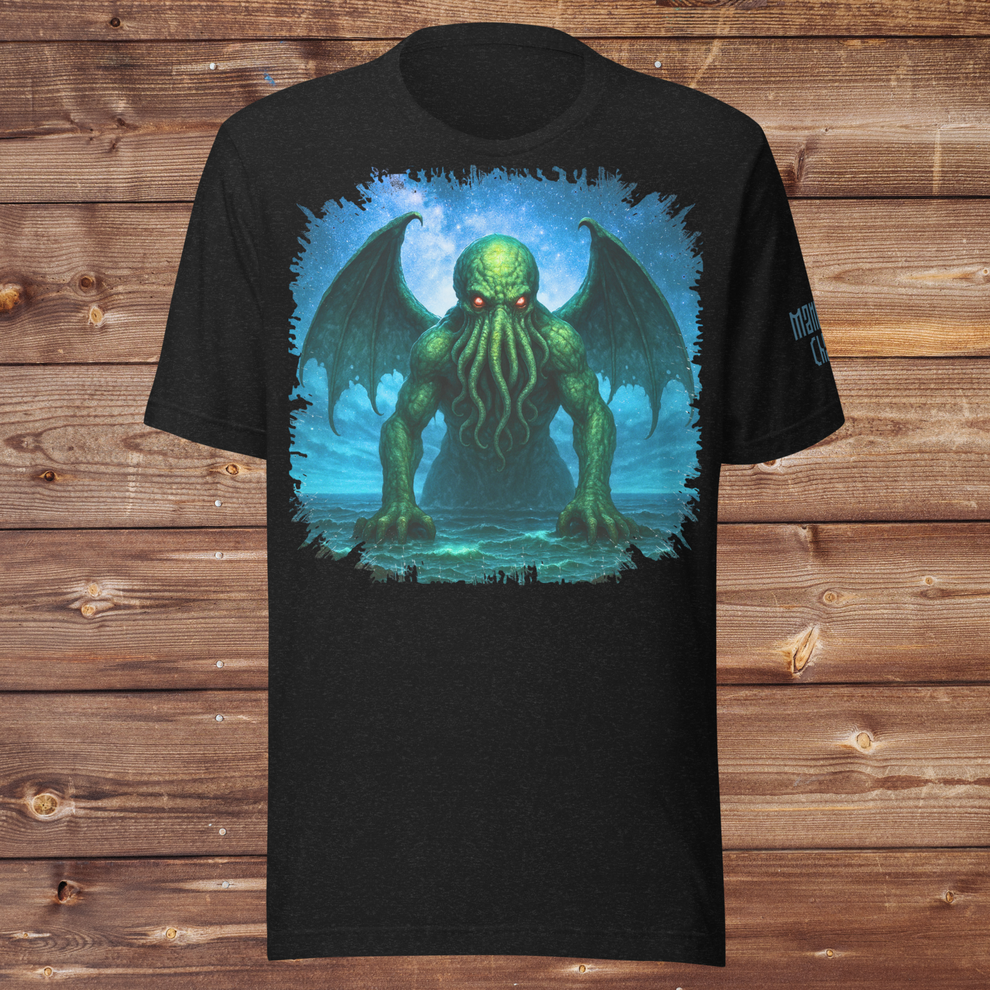 Cthulhu Black Heather Men's Graphic T-Shirt Flat View. Cthulhu Men's T-Shirt Front View on Model. Graphic upper half of shirt with night sky background. Cthulhu is emerging from the ocean. Wings spread from his back across the sky as he leans forward with tentacles hanging from his face toward the surface. He glows in green with radiant red eyes. 