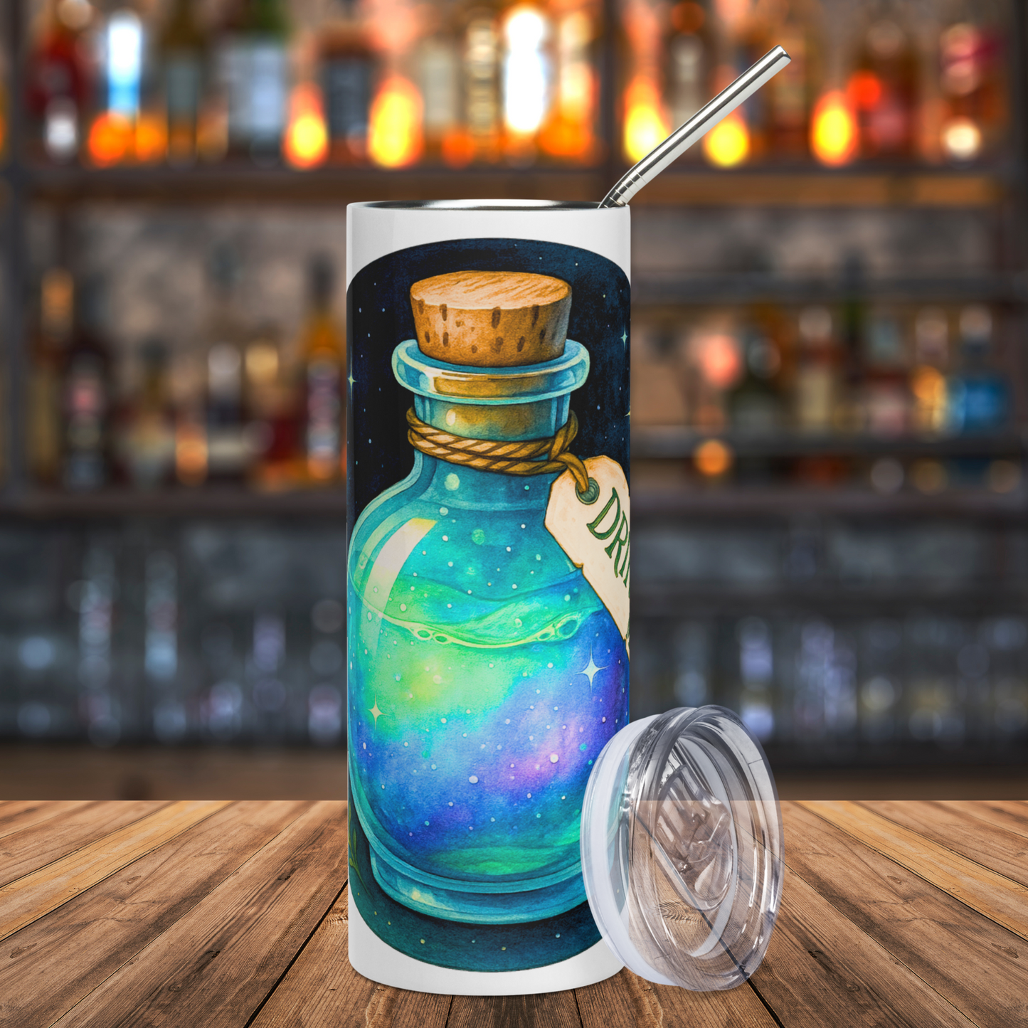 Drink Me 20 oz Stainless Steel Tumbler Front View, Leaning against the right side is a BPA free plastic lid. Round glass potion bottle with a cork. Hemp tied around the bottle's neck. You can see part of the tag with the letters DR visible. Potion is blue-green iridescent with base of purple. Witchy Spell Bottle