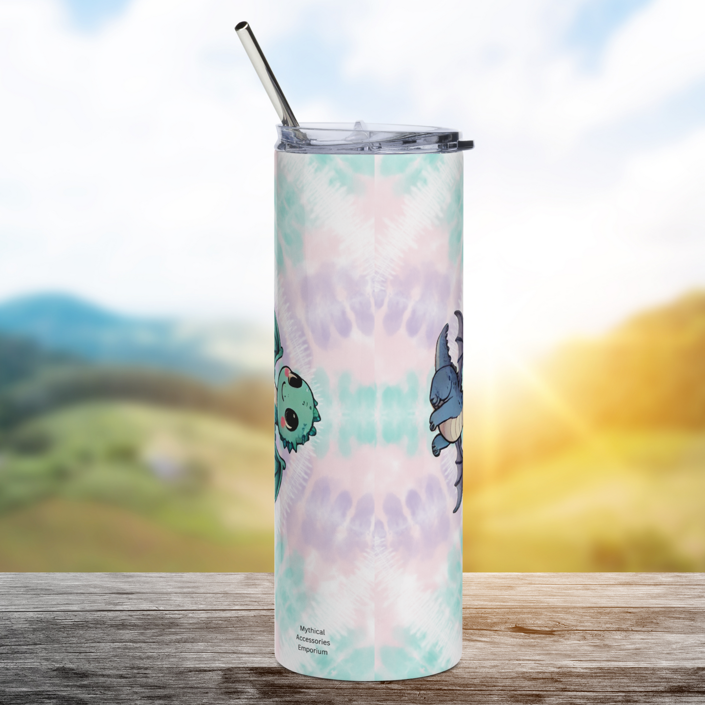 Everyday Magic Dragon Stainless Steel 40 oz Tumbler Back view. Tie dye background of greens, purples, and pinks. To the right you see the bottom of the blue kawaii dragon and to the left you see the top of the green kawaii dragon's head. Dragon Gift for a Friend