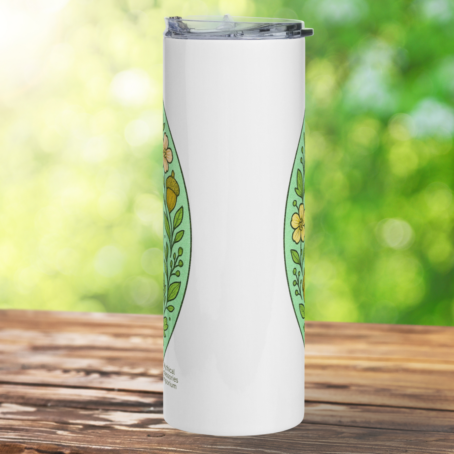 Fairy Circle 20 oz Stainless Steel Travel Tumbler back view. The back view of the white tumbler.  To the left and to the right you see the edges of the floral border Bookish Merch Gift