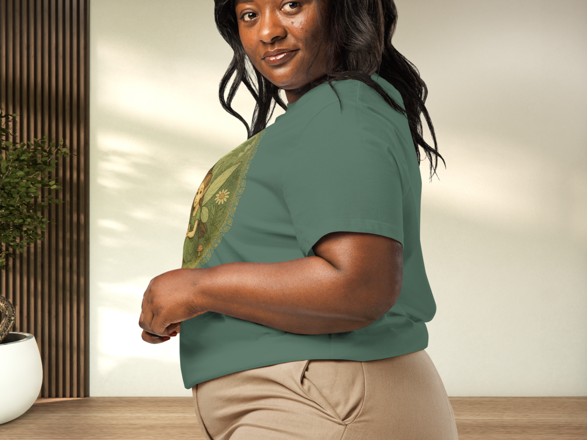 Woman wearing a bay green shirt to show left side view on curvy model with shirt tucked in. 