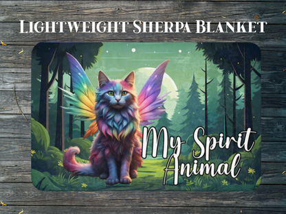 Lightweight Sherpa Throw Blanket. Longhaired Maine Coon Cat in Rainbow Fur with Fairy Wings in Rainbow colors. Fairy Cat is sitting in a moonlit forest with a full moon behind the cat. The background is in greens. The cat is pinks, purple, blue, yellow, and orange pastels. To the right bottom of the throw in white text "My Spirit Animal". Fantasy Couch throw blanket