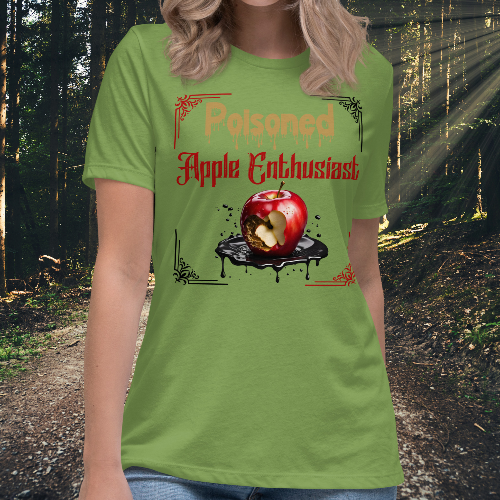 front View leaf green women's Poison Apple Enthusiast above a decaying apple sitting in a black pool of poison framed in red and black