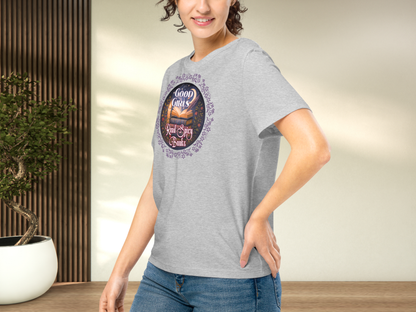 Model wearing a women's Romantasy Graphic Tee in Athletic Grey, left side view. Models arm is on hip and you can see the side seam, the graphic, the front of the collar, and that the sleeve comes to the mid point of the upper arm.