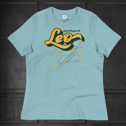 Front view of heather blue lagoon flat lay women's Leo Tee. This astrology Leo T-Shirt has the word Leo in large yellow script shadowed in deep green for a 3-D effect. Above this it Says July 23-August 22. Under Cancer is the zodiac star constellation with yellow stars connected by a black line and lighter yellow smaller stars surrounding this. The perfect July or August Birthday Gift for Her or yourself.