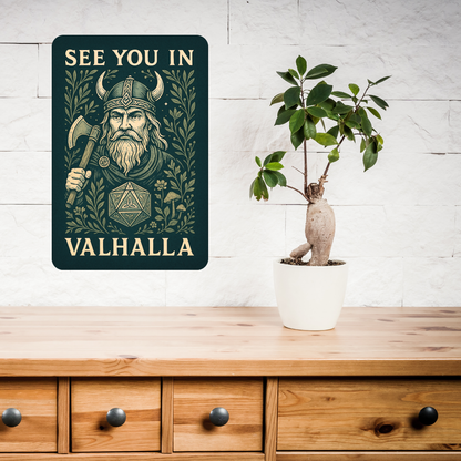 Metal  Wall Poster 8x12 hanging above a console or wooden buffet. Dark green Metal Sign with graphic in light golden browns. Bearded Viking wearing a horned helmet and holding an axe over his shoulder. D20 with symbols instead of numbers below the Viking. Botanical Design surrounding the image with mushrooms, vines, and flowers. At the top of the wall art it says, "See You In". At the bottom of the home decor, "Valhalla".  Fantasy Gaming Book Lover's Gift