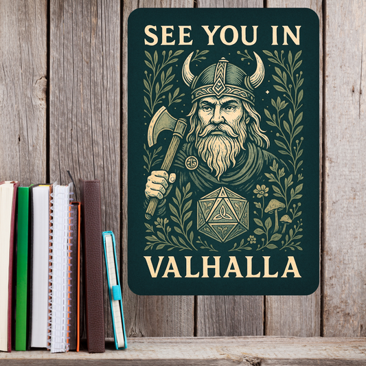 Metal  Wall Poster 8x12 hanging on a wood wall next to books. Green Metal Sign with graphic in light golden browns. Bearded Viking wearing a horned helmet and holding an axe over his shoulder. D20 with symbols instead of numbers below the Viking. Botanical Design surrounding the image with mushrooms, vines, and flowers. At the top of the wall art it says, "See You In". At the bottom of the home decor, "Valhalla".  DND Art Accessories