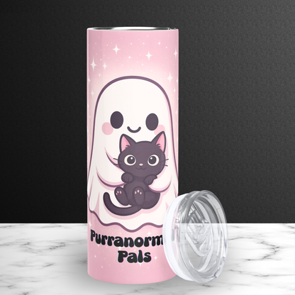 Pastel Pink Ghost Cat Tumbler 20 oz front view with BPA free plastic lid leaning against the right side. Pink tumbler with white stars surrounding the ghost. White ghost with rosy cheeks holding a black kawaii cat. Below the ghost in black text it says Purranormal Pals. Halloween Funny Tumbler