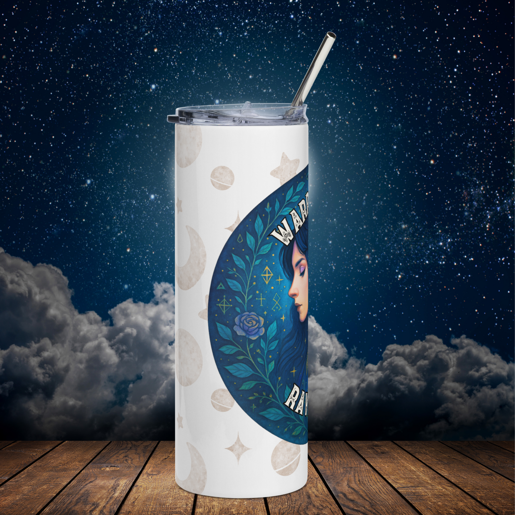 Raven Queen Stainless Steel 20 oz left side view. You see the white tumbler with a background of moons and stars. Left side of the blue circle graphic with vines and a blue purple rose. The face is visible of Morrigan. Part of the text is visible above and below the mythical figure. Witchy Book Club