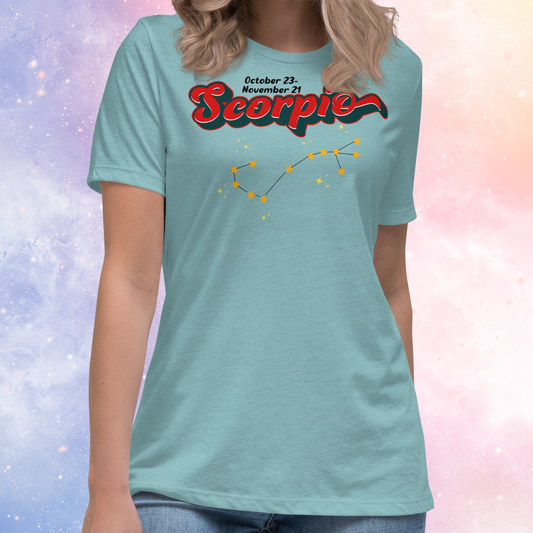 Front view of model wearing Heather blue lagoon women's Scorpio Tee. This astrology Scorpio T-Shirt has the word Scorpio in large red script shadowed in deep dark blue for a 3-D effect. Above this it Says October 23-November 21st. Under Scorpio is the zodiac star constellation with yellow stars connected by a black line and lighter yellow smaller stars surrounding this. The perfect October or November Birthday Gift for her or yourself.