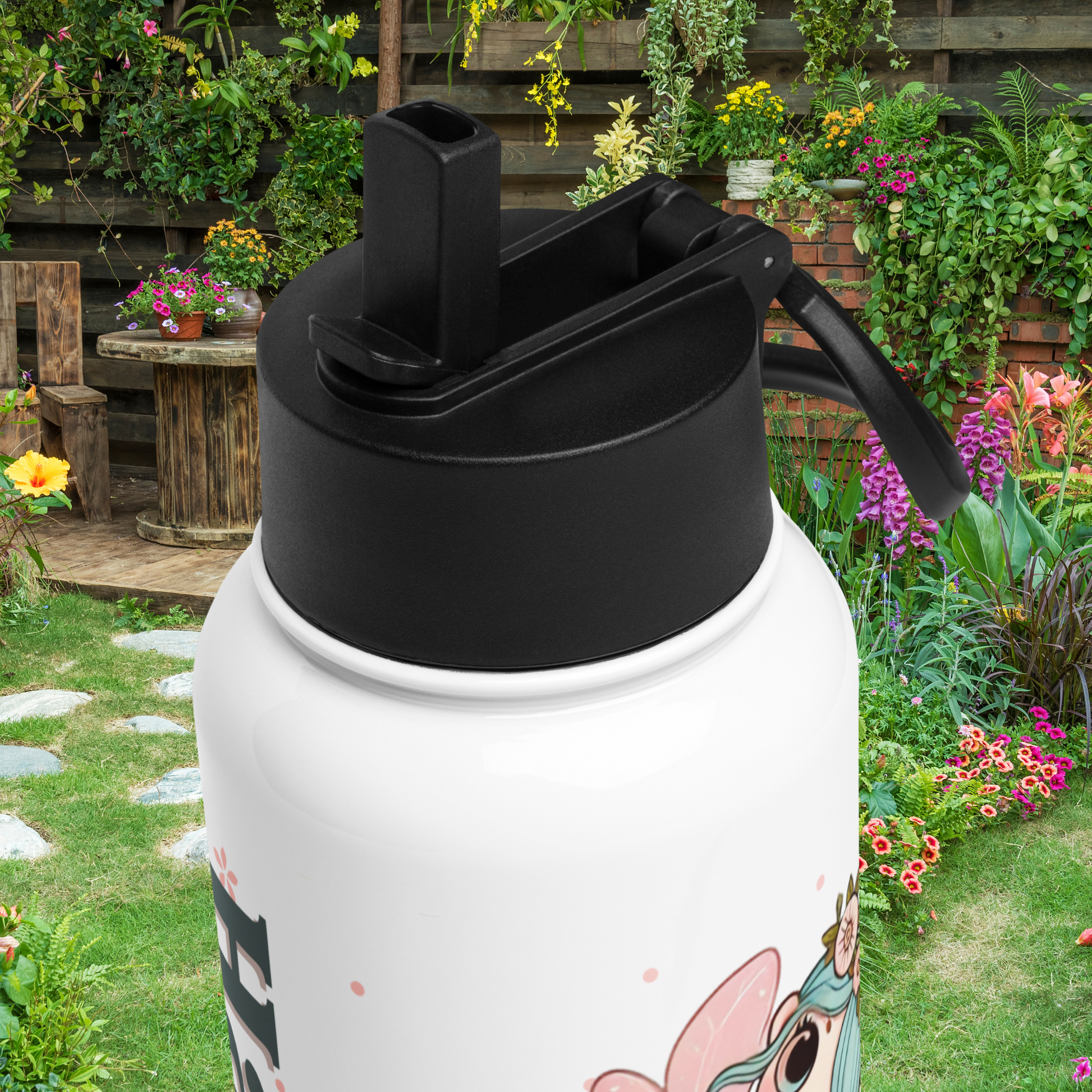 Top view of the black lid with the straw folded up and you can see the handle to is folded back. 