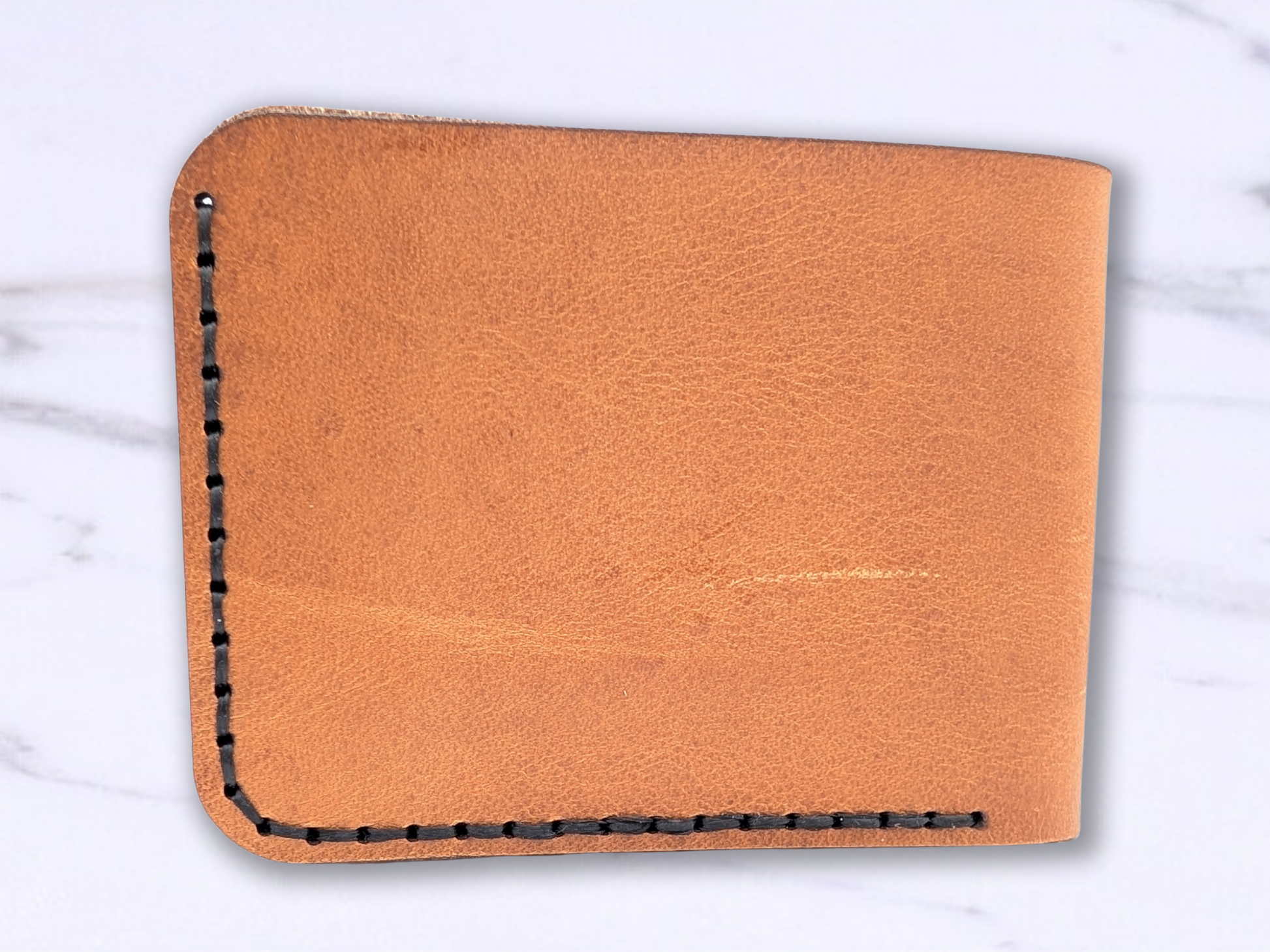 Back View of the Veg Tan Handmade Leather Wallet with dark stitching.