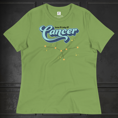 Front view of flat lay leaf green women's Cancer Tee. This astrology Cancer T-Shirt has the word Cancer in large light blue script shadowed in deep blue for a 3-D effect. Above this it Says June 21-July 22. Under Cancer is the zodiac star constellation with yellow stars connected by a black line and lighter yellow smaller stars surrounding this. The perfect June or July Birthday Gift for Her or yourself.