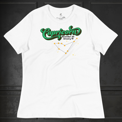 Front view of flat white women's Capricorn Tee. This astrology T-Shirt has the word Capricorn in a large green script shadowed in black for a 3-D effect. Below this it Says December 22-January 19. Under Capricorn is the zodiac star constellation with yellow stars connected by a black line and lighter yellow smaller stars surrounding this. The perfect December or January Birthday Gift for Her or yourself.