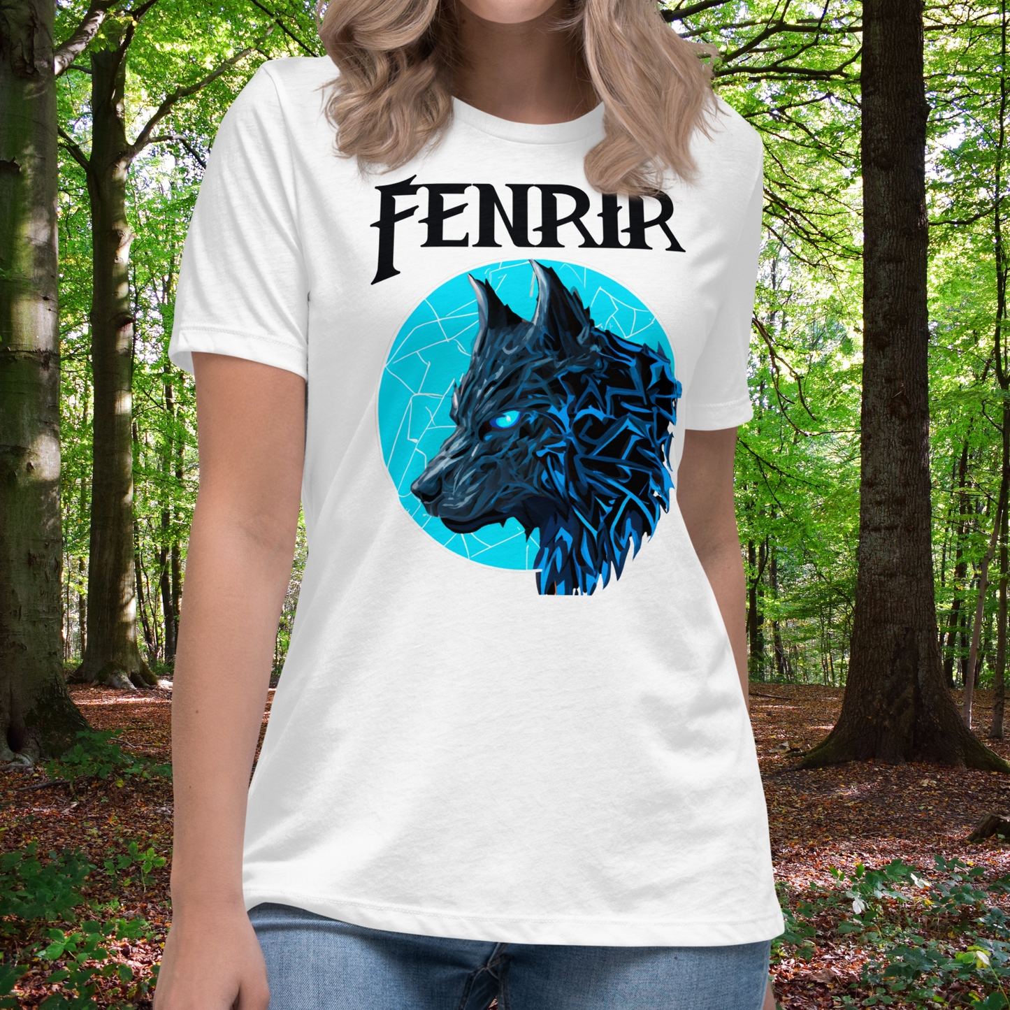 Fenrir Wolf Women's Tshirt White Front view on Model. White graphic tee with Fenrir text above a blue moon covered in cracks of lightening. The head of Fenrir the Wolf is looking to the right. His ears are up and his eyes are a bright blue. Pop art Graphic with the fur highlighted in lightening blue. Fantasy Gift for Her