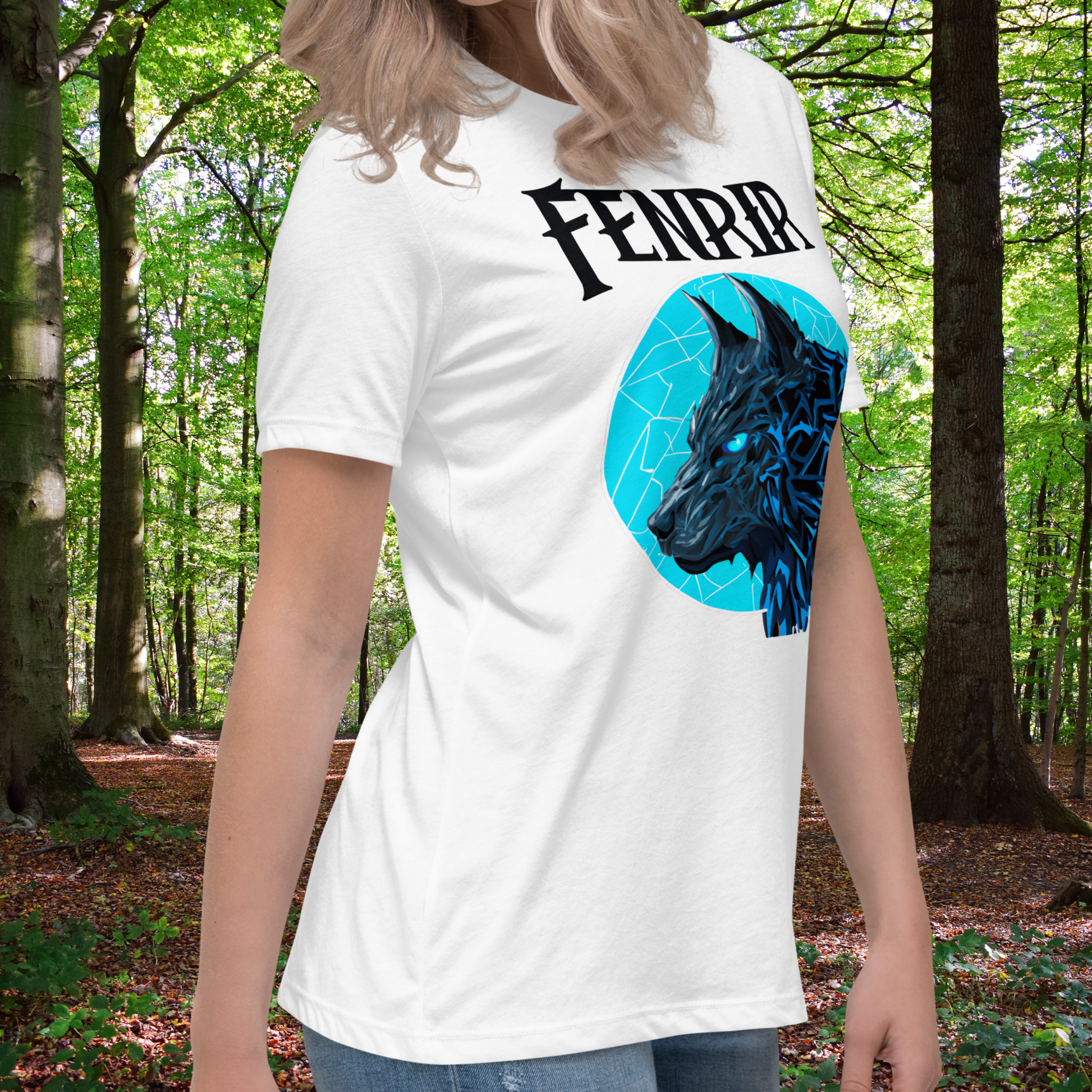 Fenrir White Graphic Wolf Tee on model right side twist view. White graphic tee with Fenrir text above a blue moon covered in cracks of lightening. The head of Fenrir the Wolf is looking to the right. His ears are up and his eyes are a bright blue. Pop art Graphic with the fur highlighted in lightening blue. Norse pagan Viking gift