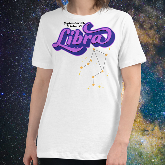 Front view of model wearing white women's Libra Tee. This astrology Libra T-Shirt has the word Libra in large purple script shadowed in deep blue for a 3-D effect. Below this it Says September 23-October 22. Under Libra is the zodiac star constellation with yellow stars connected by a black line and lighter yellow smaller stars surrounding this. The perfect October or September Birthday Gift for Her or yourself.