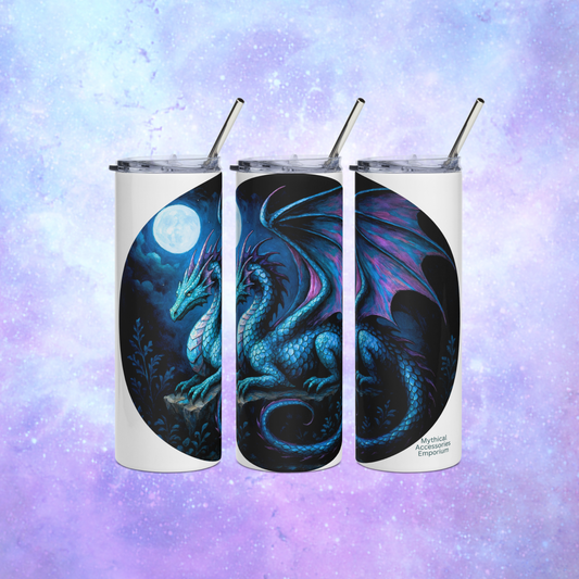 Dragon Insulated stainless steel tumbler. You can see three sides in this image for a full view of a blue dragon with purple highlights on the wings, horns, and tail. The dragon is resting on an outcrop of rocks at night. There is a dark cloudy sky with a full moon. Everything is in blues and purple. You can see the stainless steel straw sticking up from the plastic lid. The graphic is on a white tumbler. 