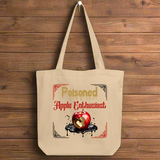 Front view Natural Organic Tote Bag Poisoned Apple Enthusiast above a decaying apple sitting in a pool of poison