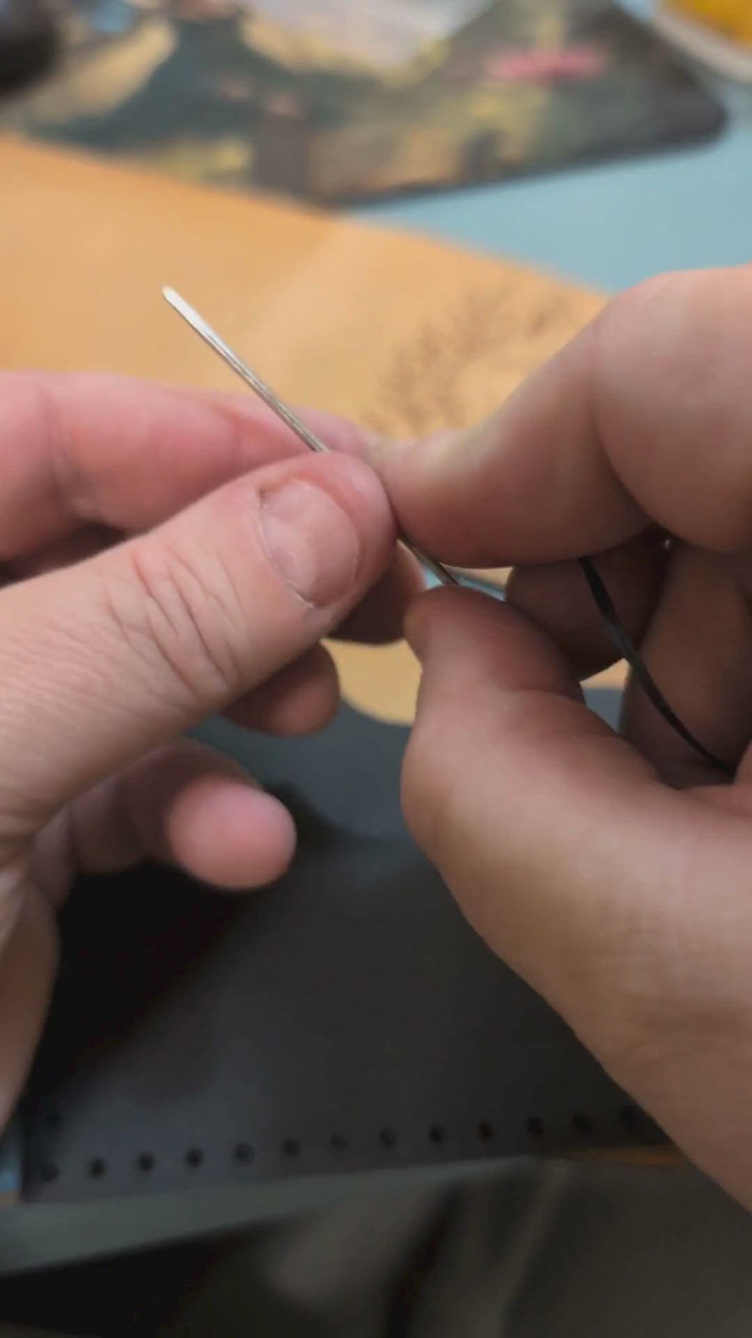 Video of the veg tan leather bi fold wallet being hand stitched together to form the cash compartment and to attach the card pockets. 