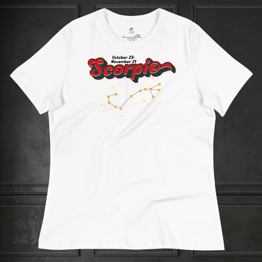 Front view of flat what zodiac women's Scorpio Tee. This astrology Scorpio T-Shirt has the word Scorpio in large red script shadowed in deep dark blue for a 3-D effect. Above this it Says October 23-November 21st. Under Scorpio is the zodiac star constellation with yellow stars connected by a black line and lighter yellow smaller stars surrounding this. The perfect October or November Birthday Gift for her or yourself.