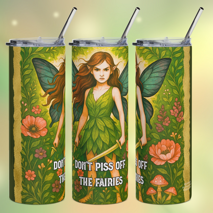Stainless Steel Tumbler 20 oz. Fairy/ Pixie holding a sword in her left hand and knife in the left hand. Angry expression, pointed ears, long brunette hair, blue outspread butterfly wings, dress made from leaves. Looking angry and ready for battle she stands amidst flowers. Don't Piss Off The Fairies at the bottom. You can see the left side, the front, and the right side of the tumbler. 