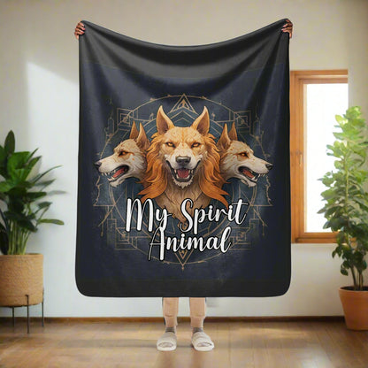 My Spirit Animal Cerberus Blanket. Front view held up by model, 50"60", perfect as a couch throw, standard throw size. A three headed guardian of the underworld in golden browns with jaws open to display canines. Below the underworld guardian is my spirit animal. Background is Dark grey almost black.