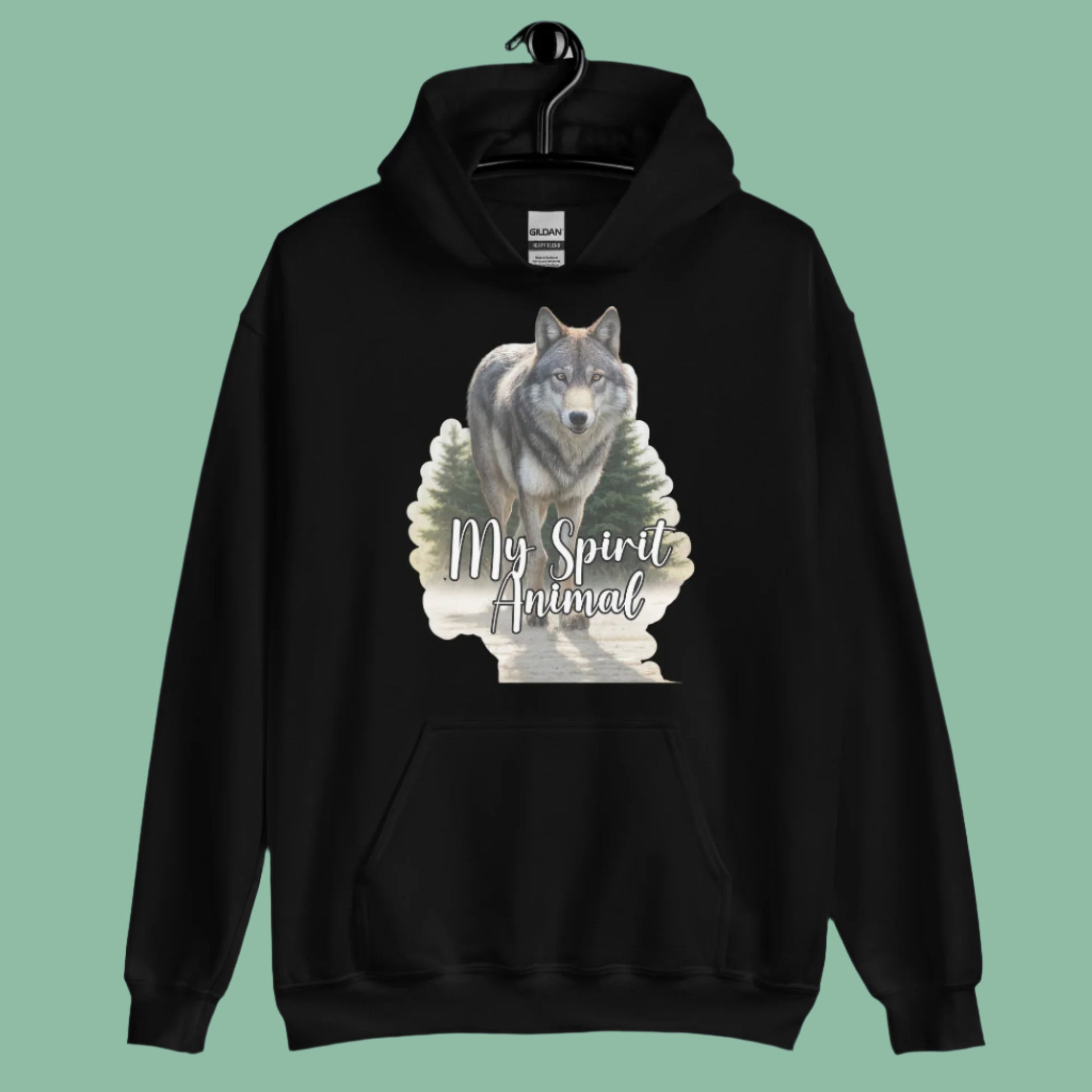 Wolf Women's Hoodie My Spirit Animal. Front view on hanger black Graphic Hoodie. A grey timberwolf gazes at you from the forest. Timber Wolf Shamanic Totem Animal, Mythical Accessories Emporium.