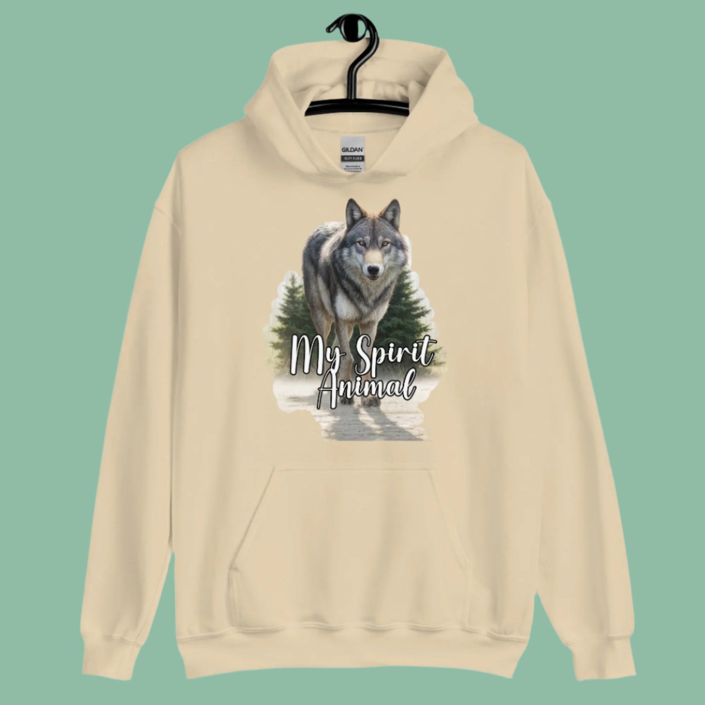 Wolf Women's Hoodie My Spirit Animal. Front view on hanger Sand Graphic Hoodie. A grey timberwolf gazes at you from the forest. Timber Wolf Shamanic Totem Animal, Mythical Accessories Emporium.