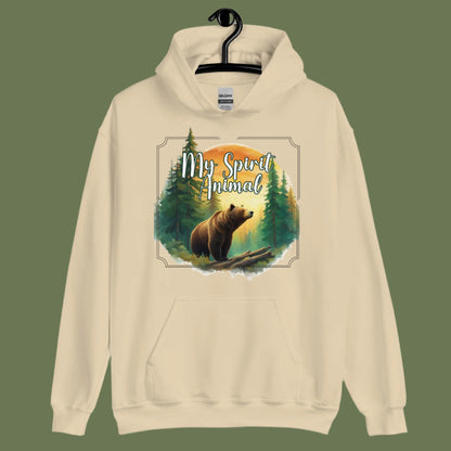 My Spirit Animal bear women's hoodie. Front view on hanger sand hoodie.  Grizzly Bear paused in front of logs walking through the forest framed in a sunset. My Spirit Animal text at the top in white script.