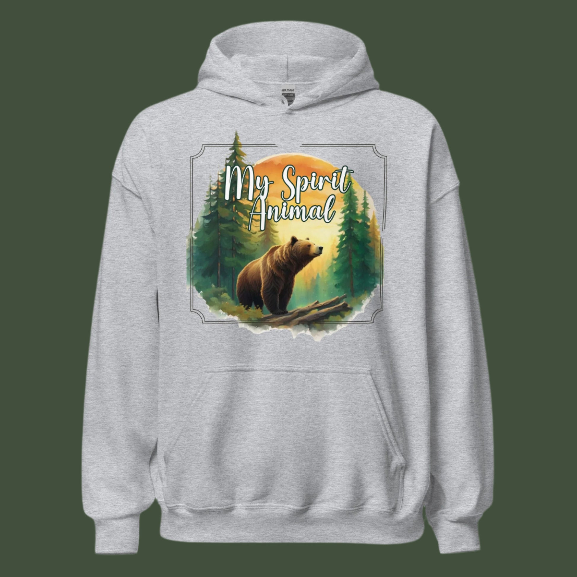 My Spirit Animal bear men's graphic hoodie. Front view on hanger sport grey hoodie.  Grizzly Bear paused in front of logs walking through the forest framed in a sunset. My Spirit Animal text at the top in white script. Mythical Accessories