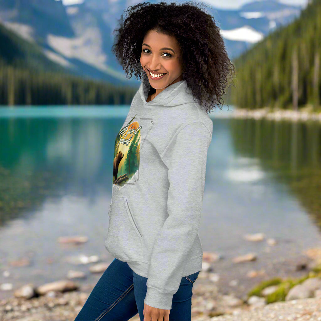 My Spirit Animal bear women's hoodie. Left side view model sport grey hoodie.  Grizzly Bear paused in front of logs walking through the forest framed in a sunset. My Spirit Animal text at the top in white script.