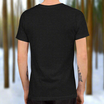 Men's T-Shirt Black Heather back View. Winter Fey with antlers, long red velvet dress trimmed in fur, walking a snow covered path in a forest holding lanterns.