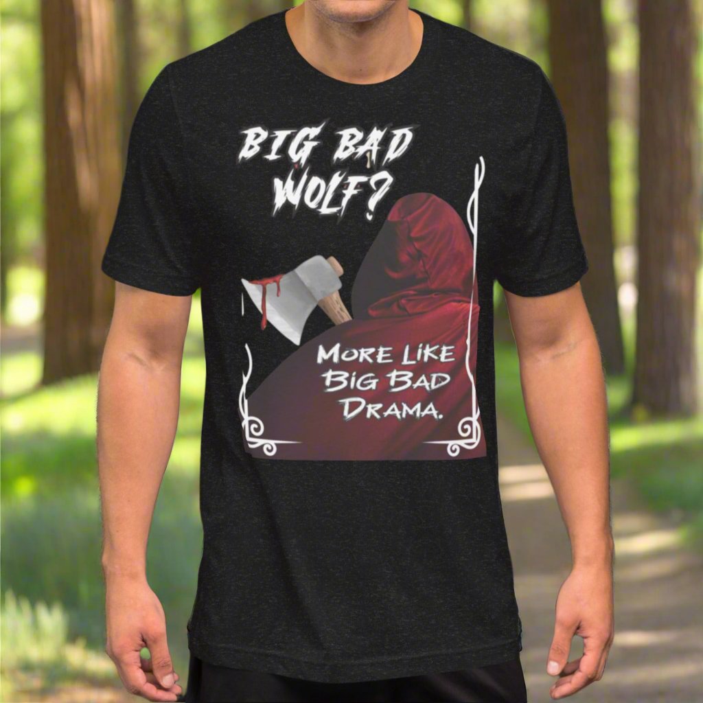 Black Heather Front View Little Red Riding Streetwear Graphic Men's T-shirt. Big Bad Wolf? More Like Big Bad Drama. Graphic of the back of Little Red Riding Hood's Cloak with the hood up. Axe over her shoulder dripping in gore. 