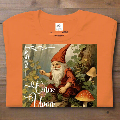 Once Upon A Time Mens Burnt Orange T-shirt folded flat. Vintage Gnome Fairy Tale Shirt. Gnome Sitting in Forest holding a pipe surrounded by mushrooms. Once Upon A Time Text