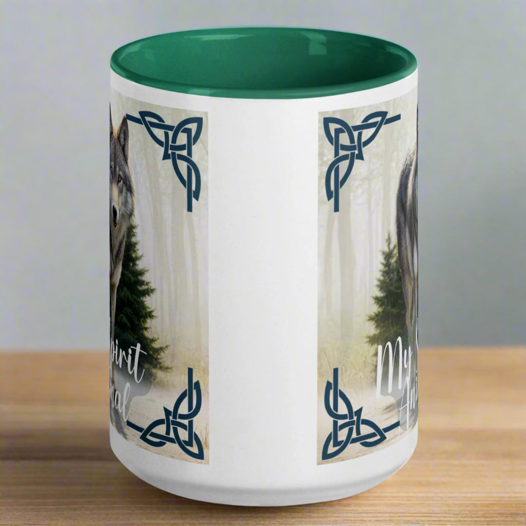 Wolf My Spirit Animal Ceramic Coffee Mug. Handle to the back with a green interior. A grey wolf gazes at you from the forest bordered in Celtic knots. Timber Wolf Shamanic Totem Animal, Mythical Accessories Emporium.