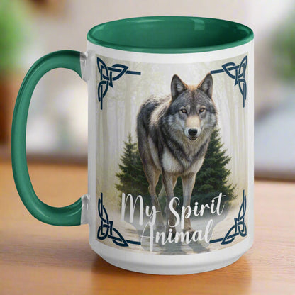 Wolf My Spirit Animal Ceramic Coffee Mug. Handle to he left with a green interior and handle. A grey wolf gazes at you from the forest bordered in Celtic knots. Timber Wolf Shamanic Totem Animal, Mythical Accessories Emporium.