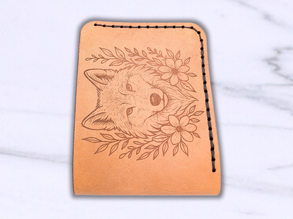 Wolf Bi Fold Hand sewn wallet laying flat with the folded edge to the front of the photo. 