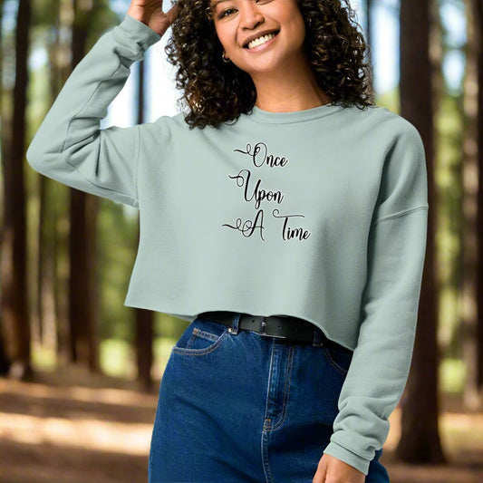 Front View, Women's Cropped Sweatshirt in dusty blue, Once Upon A Time in black text edged in white, Fancy script