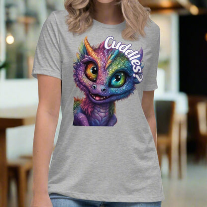 athletic Heather Grey Dragon Cuddles Front View Women's T-Shirt. Whimsical purple iridescent  dragon looking up at the word Cuddles? above his head