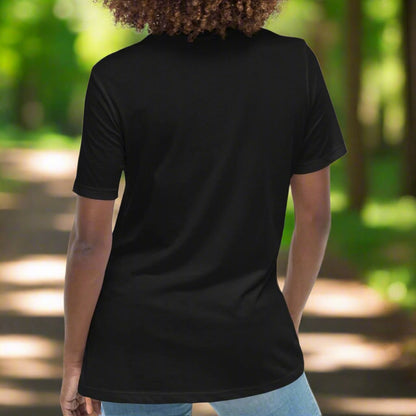 Back view of model wearing a relaxed women's tshirt in black.