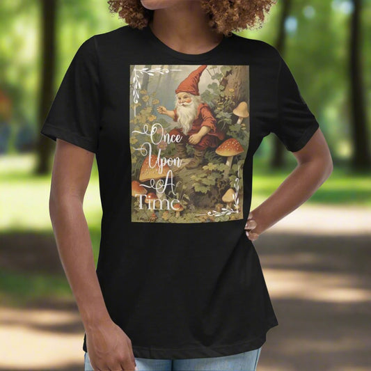 Front view of model wearing a relaxed black women's graphic t-shirt. Vintage Once Upon A Time Graphic of gnome dressed in red with a red cap sitting in a forest.