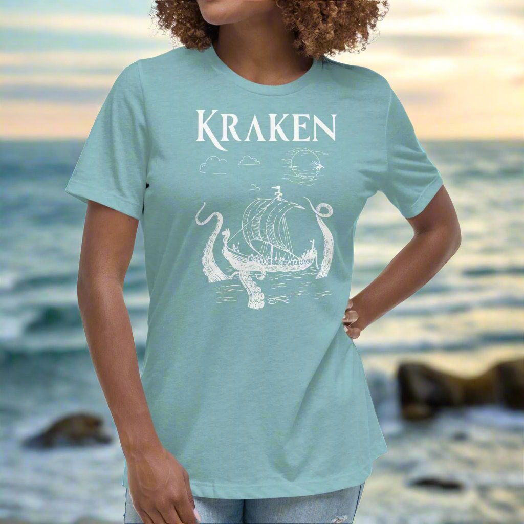 Heather Blue Lagoons Front View Women's T-Shirt. Kraken, night sky, Viking long ship surrounded by tentacles in the ocean. Viking Shirt.