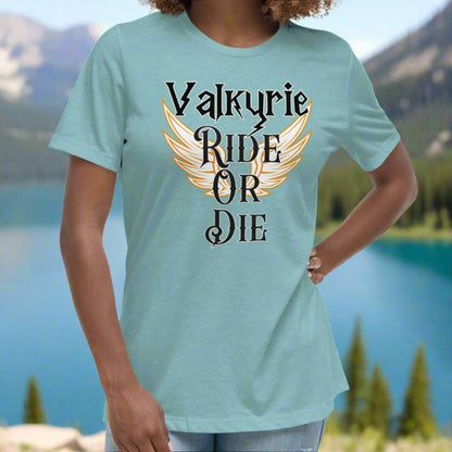 Women's heather blue lagoon Front View T-Shirt. White Valkyrie wings edged in gold spread to both sides. Text on shirt Valkyrie Ride or Die.