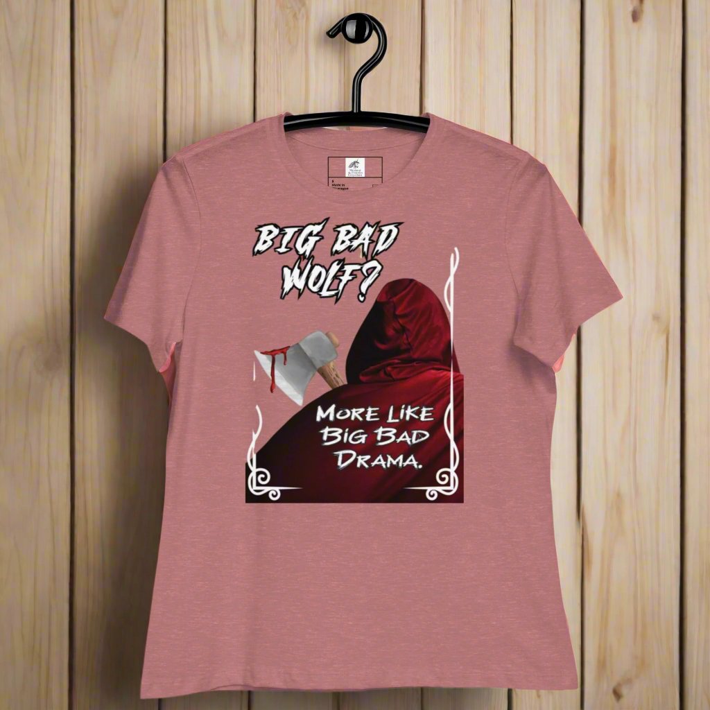 Heather Mauve Women's Graphic T-Shirt model front view on a hanger. Big Bad Wolf Little Red Riding Hood. Big Bad Wolf? More Like Big Bad Drama. Back of Red Riding Hood with hood pulled up, bloodied axe over shoulder.