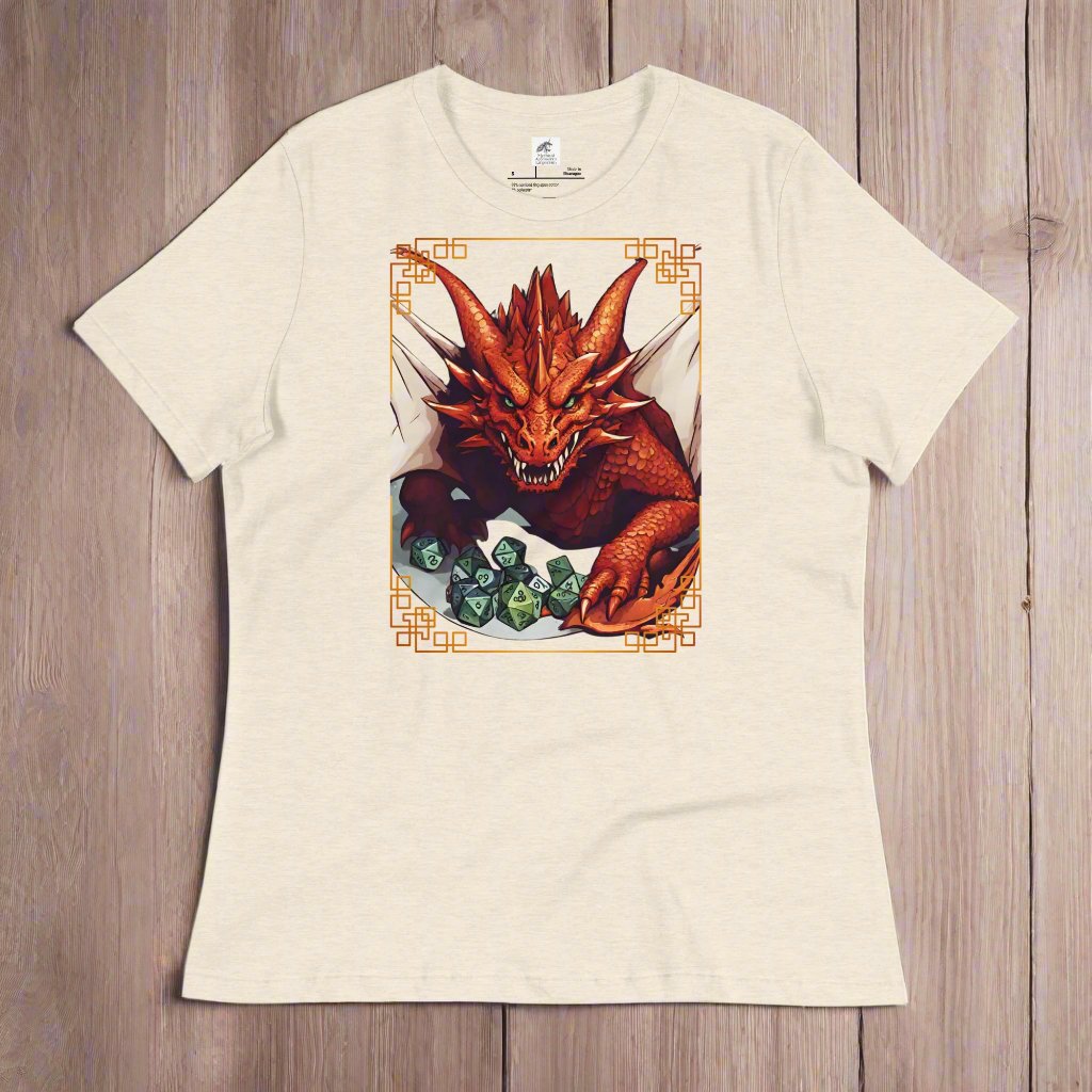 heather prism natural (light natural) Front View Women's  T-Shirt on a wooden surface. DND players gift for adventurers. Red Dragon, wings spread, stalking over a pile of D20 and other dice. RPG and Dungeons Masters